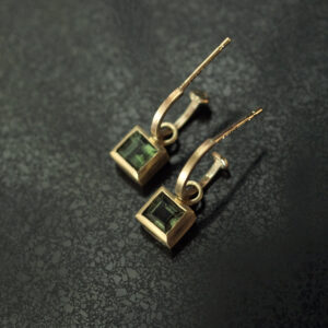 Tiny gold hoops with green square tourmalines